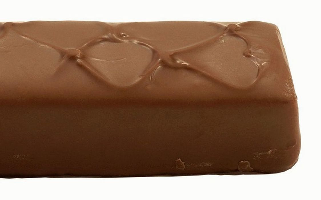 A stack of dark chocolate bars with artisan wrappers